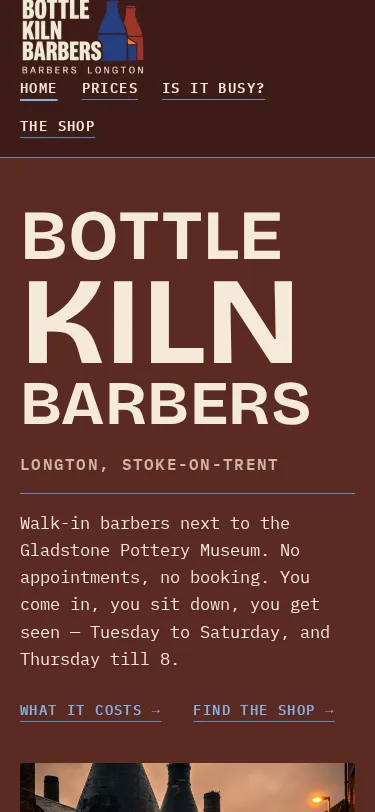 The Bottle Kiln Barbers home page on a phone: the name in large letters on a brick-red background, and the shop's address in Longton.