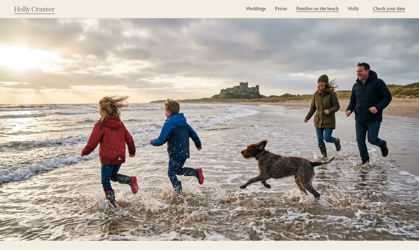The example's family page: two children, a dog and two adults running through the surf, a castle behind them.