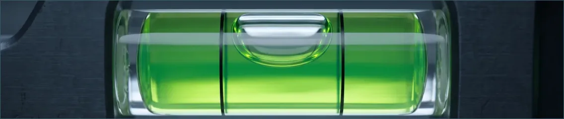A spirit level against the bathroom tilework, cropped from the fictional On the Level example.